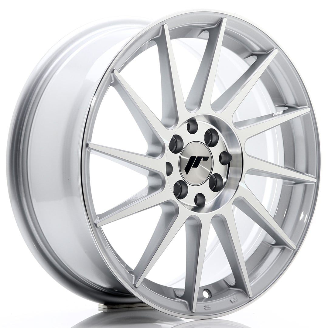 34828_0_22678jpg - OPSHOLDERS Silver twelve-spoke alloy car wheel with a polished center cap and lug holes seen from the front/side angle.