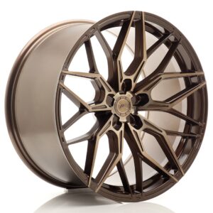 Bronze alloy car wheel rim with intricate spoke design, viewed at an angle on a white background