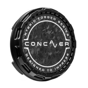 Black circular car wheel center cap with a textured carbon‑fiber pattern and white branding reading CONCAVER, HYBRID FORGED SERIES, DESIGNED TO IMPRESS