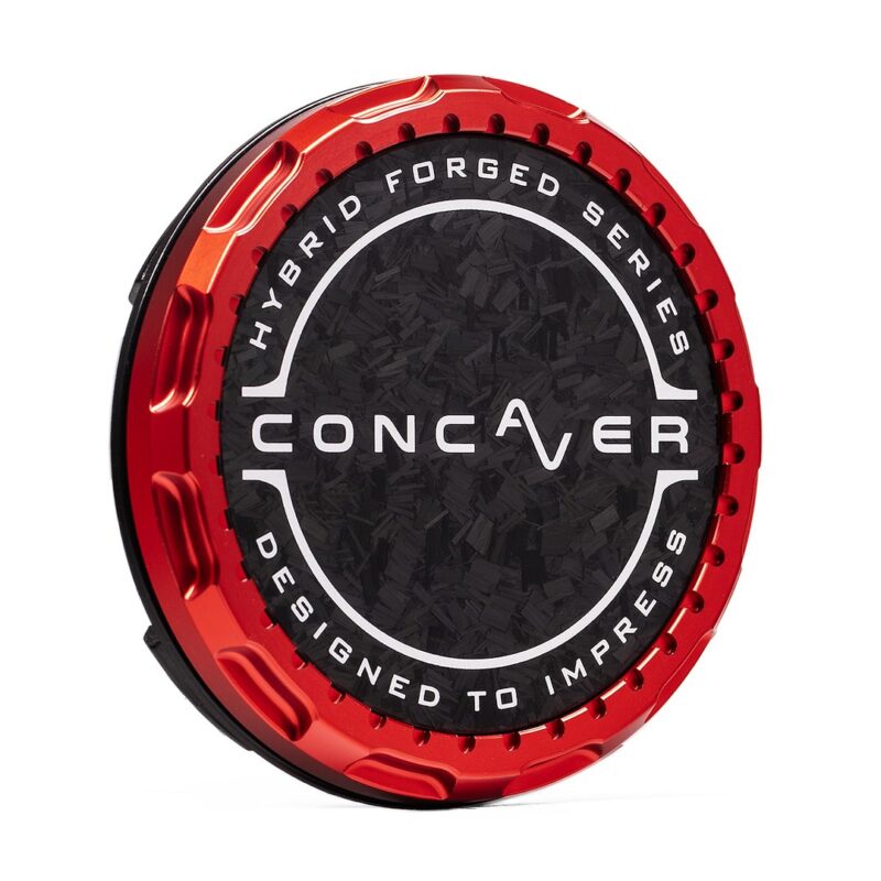 Red metallic wheel center cap featuring a black textured center with white circular text: 'Hybrid Forged Series' and 'Designed to Impress'.