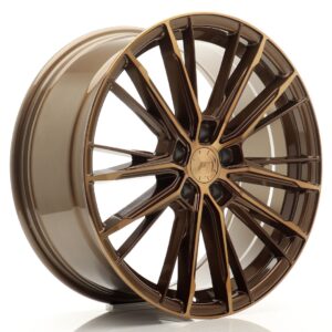 Bronze multi-spoke alloy car wheel rim photographed against a white background, showcasing its polished finish and central hub.