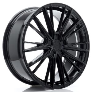 Glossy black multi-spoke alloy wheel photographed from the side, showing a polished finish and intricate spoke design