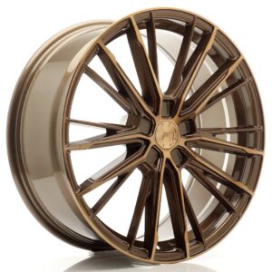 Bronze finished multi-spoke alloy car wheel rim on a white background you can see its glossy finish.
