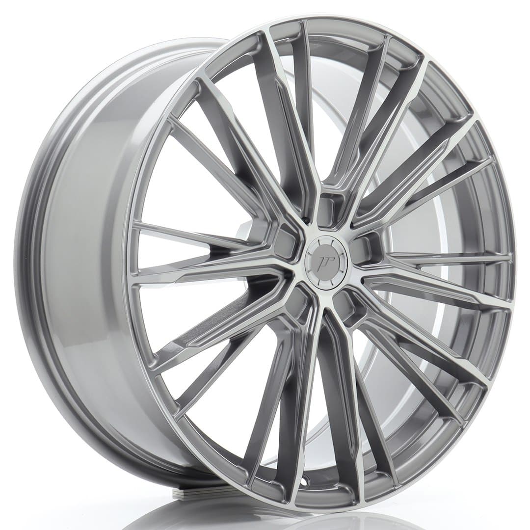 52880_0_39178jpg - OPSHOLDERS Silver multi-spoke alloy car wheel rim with a central cap, shown at an angled view.