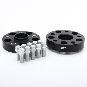 Two black wheel spacers with multiple lug bolt holes, shown alongside a row of silver lug bolts on a white background (wheel spacer kit).
