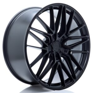 Black glossy multi-spoke alloy car wheel rim (close-up).