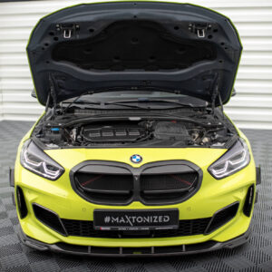 Front view of a neon yellow BMW with the hood open, exposing the engine bay and components; license plate reads #MAXTONIZED.