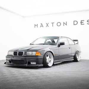 Silver BMW coupe in a white studio showroom with the Maxton Design logo on the wall behind it.