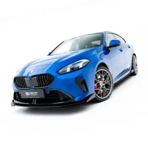 Blue sports car shown from a low front-left angle on a white background, emphasizing its sleek front end and large wheels.