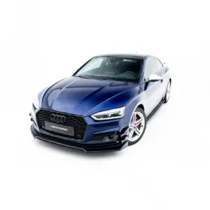 Blue Audi coupe shown from the front-right, isolated on a white background with prominent grille and wheels visible at the bottom edge.