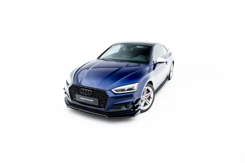 Blue Audi coupe shown from the front-right, isolated on a white background with prominent grille and wheels visible at the bottom edge.