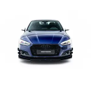 Front view of a blue Audi car facing forward, displaying the grille and headlights with a '#MAXTONIZED' plate text.