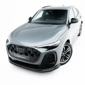 Front-facing angle of a silver Audi SUV, highlighting the bold black grille, rounded hood, and alloy wheels with '#MAXTONIZED' on the front plate.