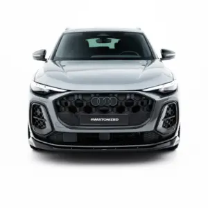 Front view of a silver Audi SUV with a bold black honeycomb grille and #MAXTONIZED on the front plate.