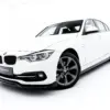 pol_po_Front-Splitter-BMW-3-Sportline-Sedan-Touring-F30-F31-23858_6webp - OPSHOLDERS White BMW sedan photographed in a bright studio, front-right angle showing grille and headlights
