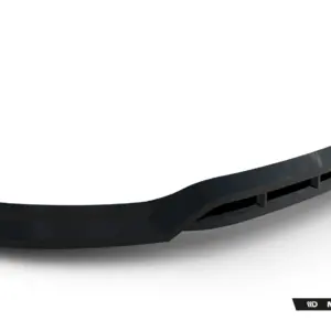 Promotional banner showing a glossy, curved black automotive aero part with a metallic update against a white background, Maxton Design branding in the bottom-right corner.
