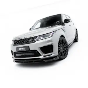 Front three-quarter view of a white Range Rover SUV with black alloy wheels, showcased in a bright studio setting.