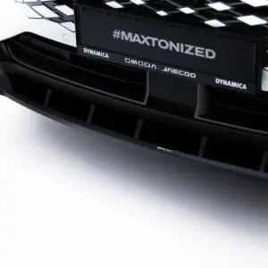 Close-up of a black car front with bold '#MAXTONIZED' branding across the grille.