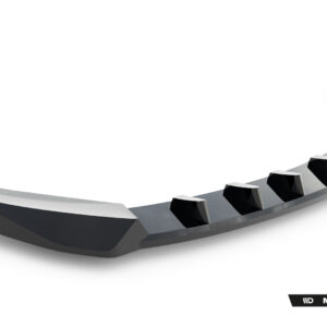 Curved metallic car bumper lip with angular fins along the inner edge, set against a white background.