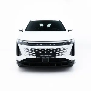 Front view of a white OMODA SUV facing the camera, with a bold black grille and distinctive diamond pattern.