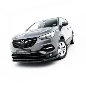 Front three-quarter view of a silver Opel car against a white studio background