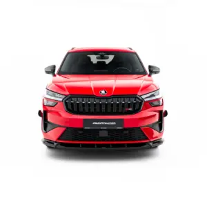 Front view of a red SUV with a bold black grille and Skoda emblem against a white background.