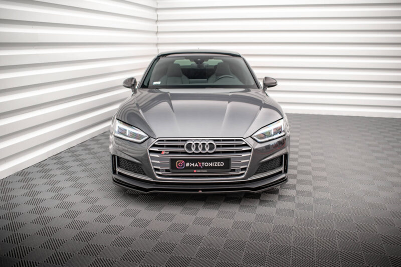pol_po_Front-Splitter-V-1-Audi-S5-A5-S-Line-F5-Coupe-Sportback-5599_2jpg - OPSHOLDERS Front view of a gray Audi sedan in a modern, white-panel showroom with a checkered floor; license plate reads '#MAXTONIZED' Instagram tag.