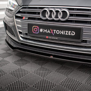Front view of a gray Audi S5 highlighting the chrome grille and four-ring emblem, with a black plate reading '#MAXTONIZED'