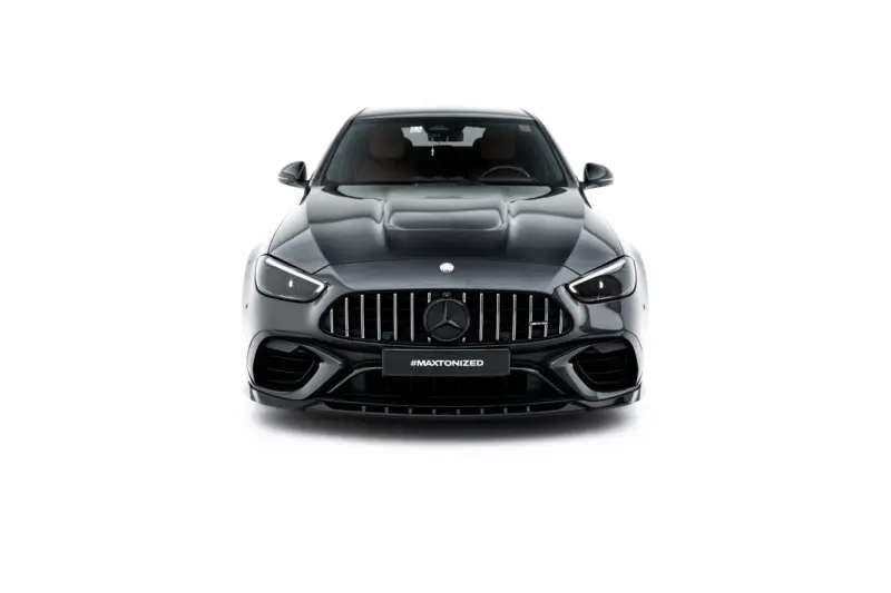 Front view of a dark gray Mercedes-Benz SUV, with a prominent chrome grille and emblem, and a #MAXTONIZED plate."