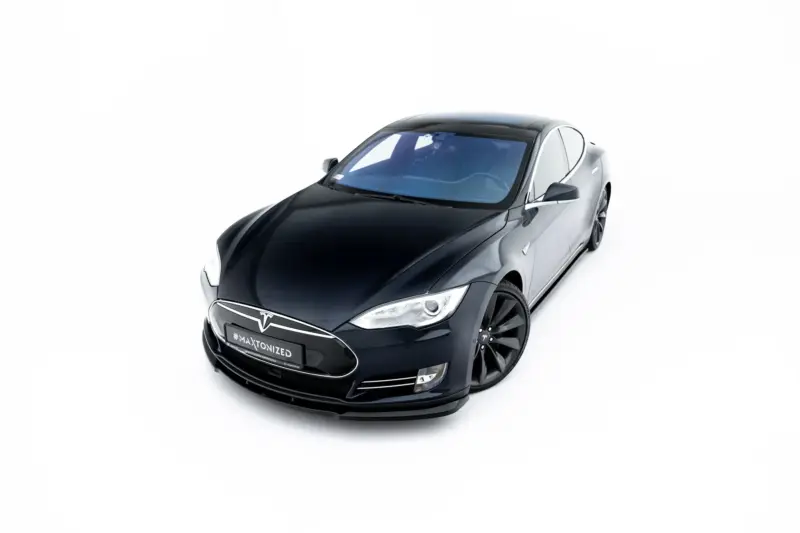Front three-quarter view of a black Tesla electric sedan on a white background, logo visible on grille.