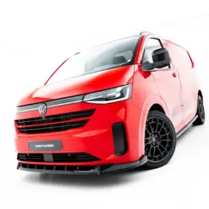 Red van angled from the front with black wheels and VW emblem, showing bold rugged design (#MAXTONIZED on plate).