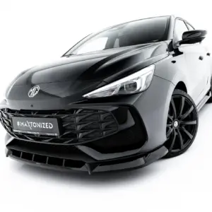 Close-up of a glossy black MG car front with a prominent grille and sleek headlight, angled against a white background.