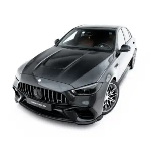 Front three-quarter view of a dark gray Mercedes-Benz AMG car with prominent grille and large alloy wheels against a white studio background, angled from above.