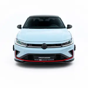 Front view of a light-blue car with a black grille and LED headlights against a white background.