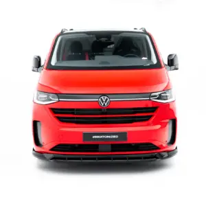 Front view of a red Volkswagen van with the VW emblem and '#MAXTONIZED' on a dark license plate against a white backdrop.
