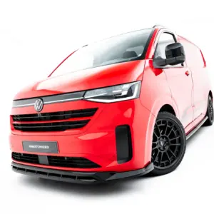 Red VW van shown from a front-left angle with a bold grille and sporty black bumper.
