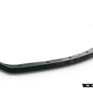 Curved black car bumper lip with mounting holes, angled across a white background (Maxton Design).