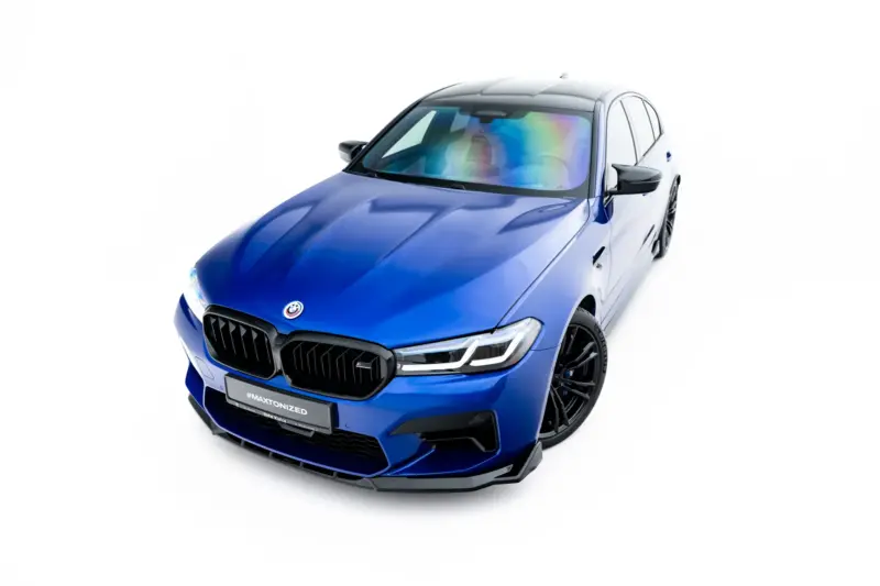 Blue BMW SUV shown from a front-left angle, highlighting the aggressive grille and sporty design.