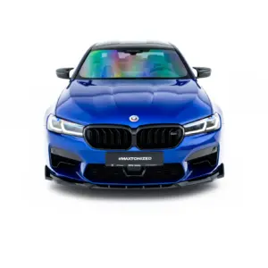 Front view of a blue BMW SUV with a prominent kidney grille and rainbow-reflective windshield.