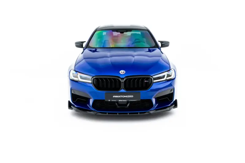 Front view of a blue BMW SUV with a prominent kidney grille and rainbow-reflective windshield.