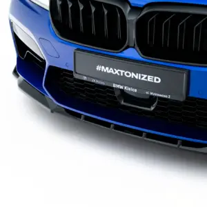 Blue BMW front end close-up focusing on the kidney grille and bumper with a #MAXTONIZED plate badge