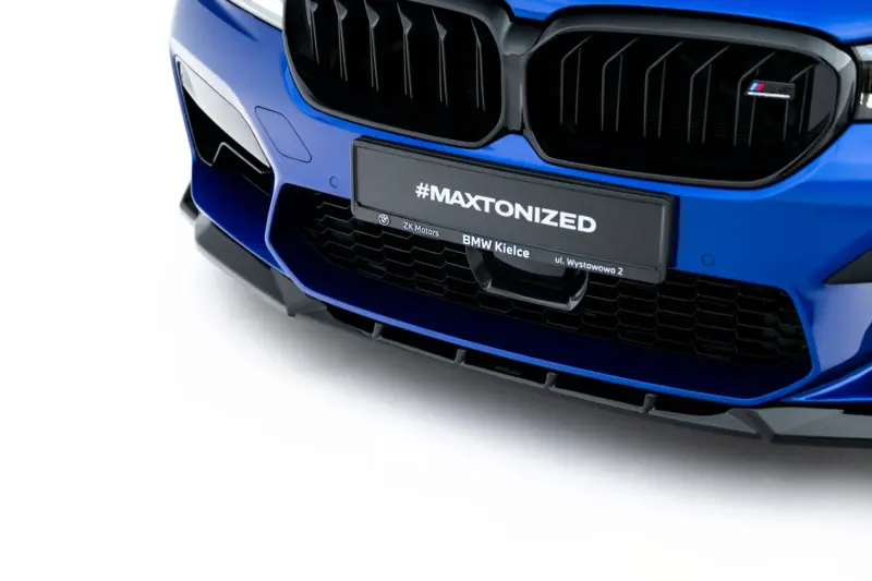 Blue BMW front end close-up focusing on the kidney grille and bumper with a #MAXTONIZED plate badge