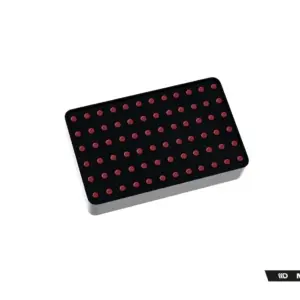Black rectangular control panel with a grid of red circular buttons on a dark surface.