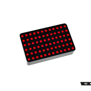 Black rectangular LED panel with evenly spaced red circular LEDs, tilted diagonally; Maxton Design logo visible in bottom corner.