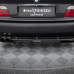 Rear view of a black car showing a customized license plate reading '#MAXTONIZED' with 'ULTRACE' logo and dual exhausts beneath.