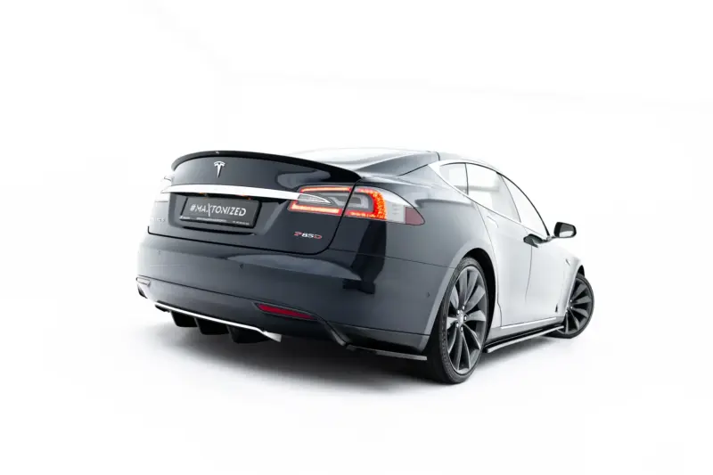 pol_po_Rear-Side-Splitters-V-1-Tesla-Model-S-Mk1-23944_3webp - OPSHOLDERS Tesla Model S rear-three-quarter view on a white studio background, showing the dark gray finish and taillights.