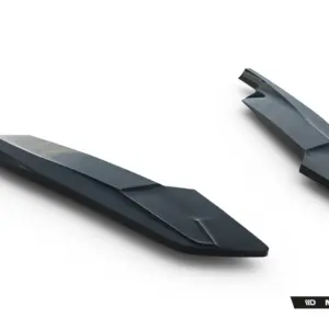 Pair of glossy dark-gray automotive splitter blades on a white background with Maxton Design branding nearby.