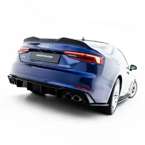 Rear three-quarter view of a blue Audi S5 convertible, featuring the spoiler, distinctive taillights, and quad exhausts