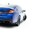 pol_po_Rear-Side-Splitters-V-2-BMW-M5-F90-Facelift-23879_5webp - OPSHOLDERS Blue BMW M5 Competition rear three-quarter view with illuminated taillights and quad exhausts, plate reading #MAXTONIZED on a white background