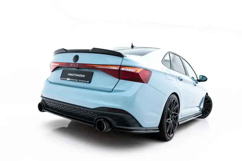 pol_po_Rear-Side-Splitters-Volkswagen-Jetta-GLI-Mk7-Facelift-2-23932_2webp - OPSHOLDERS Rear three-quarter view of a light blue sporty car with a black diffuser and dual exhausts.